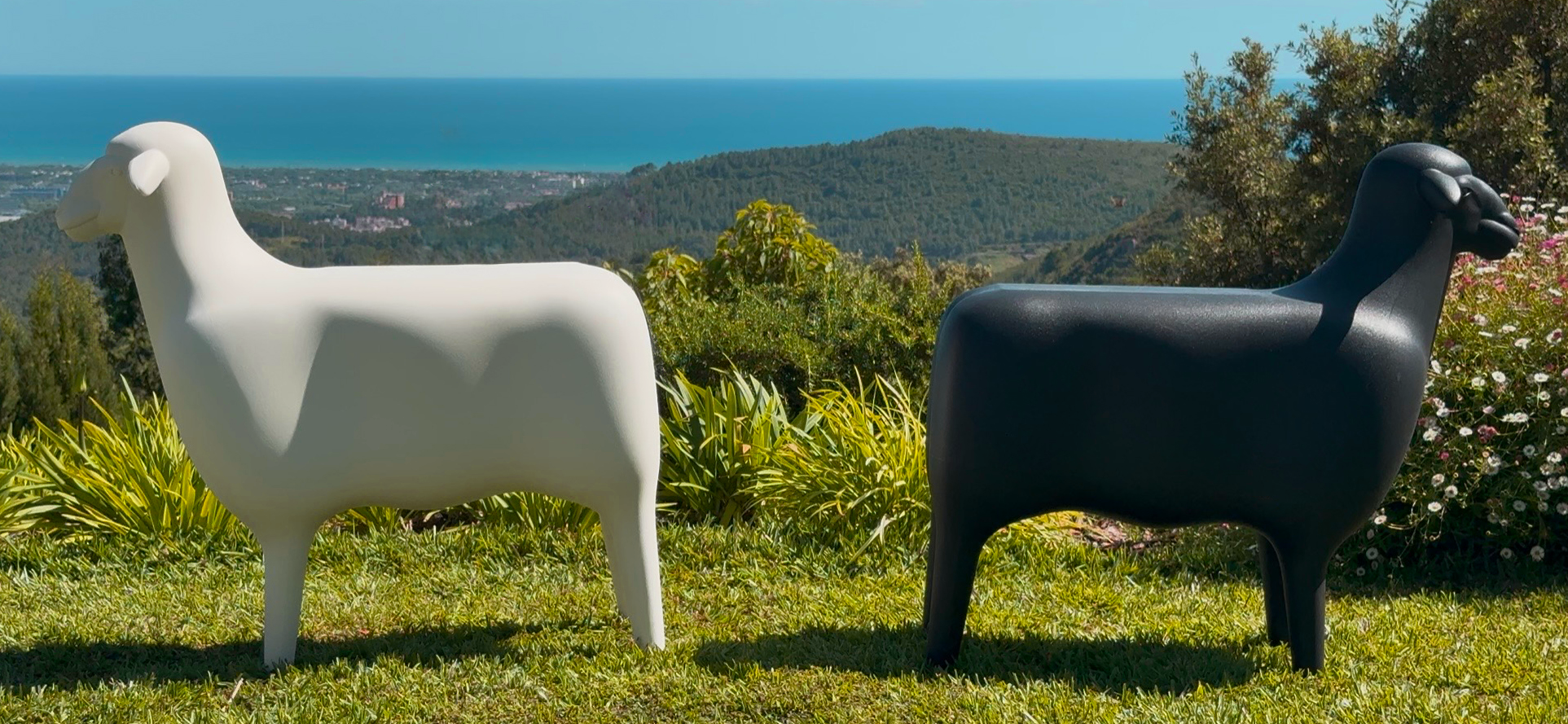 Goodnight Light SHEEP sculpture and seat in white outdoors in garden setting, designed by Marke Newton Barcelona